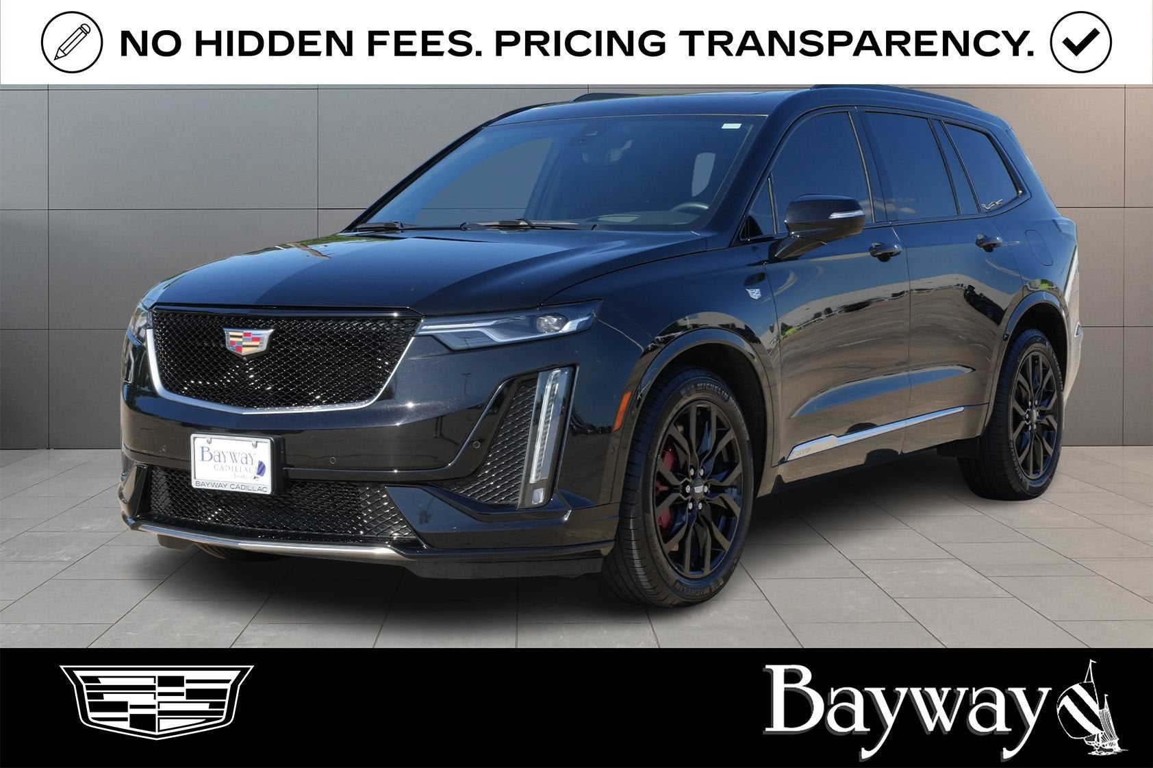 2025 Cadillac XT6 Sport in Stellar Black Metallic — front three-quarter view