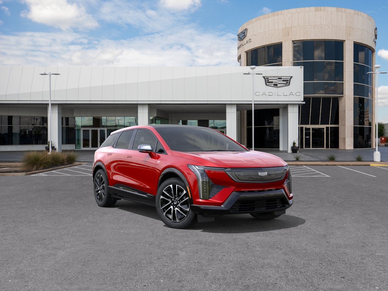 2026 Cadillac OPTIQ Sport in Radiant Red Tintcoat — front three-quarter view